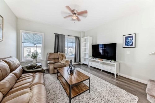 2306 Jumping Pound Common, Cochrane, AB - Indoor Photo Showing Living Room