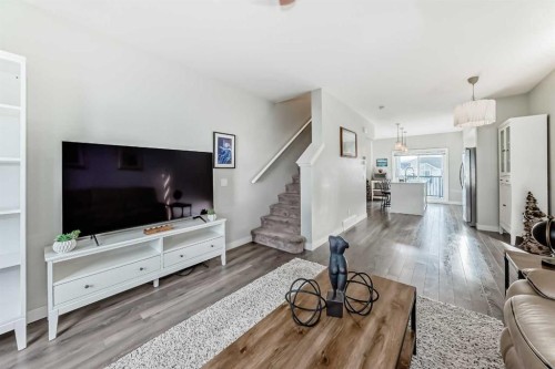 2306 Jumping Pound Common, Cochrane, AB - Indoor Photo Showing Living Room