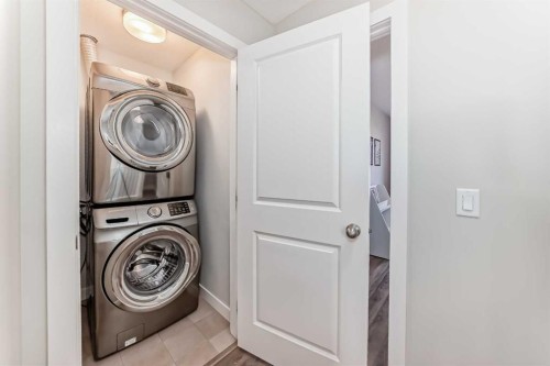 2306 Jumping Pound Common, Cochrane, AB - Indoor Photo Showing Laundry Room