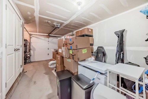 2306 Jumping Pound Common, Cochrane, AB - Indoor Photo Showing Garage