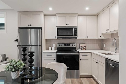 47 Setonridge Park Se, Calgary, AB - Indoor Photo Showing Kitchen With Double Sink
