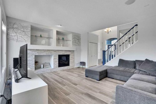 74 Cranleigh Green Se, Calgary, AB - Indoor Photo Showing Living Room With Fireplace