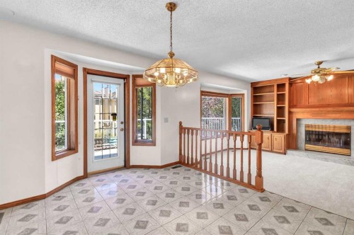 125 Edgebrook Road Nw, Calgary, AB - Indoor Photo Showing Other Room With Fireplace