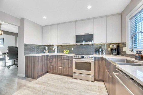 44 Douglas Shore Close Se, Calgary, AB - Indoor Photo Showing Kitchen With Double Sink With Upgraded Kitchen