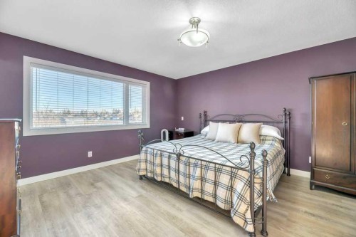 44 Douglas Shore Close Se, Calgary, AB - Indoor Photo Showing Bedroom