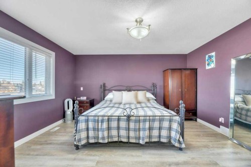 44 Douglas Shore Close Se, Calgary, AB - Indoor Photo Showing Bedroom