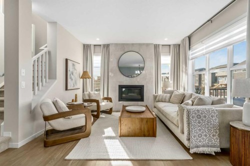 80 Magnolia Green Se, Calgary, AB - Indoor Photo Showing Living Room With Fireplace