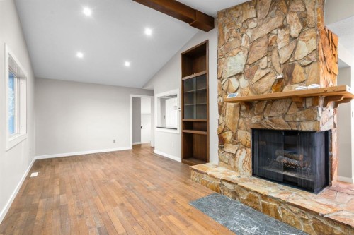 17 Gibson Road, Benchlands, AB - Indoor Photo Showing Living Room With Fireplace