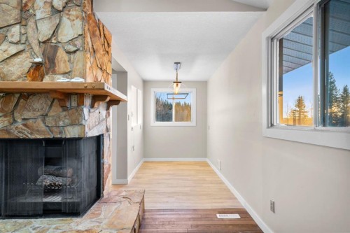 17 Gibson Road, Benchlands, AB - Indoor With Fireplace