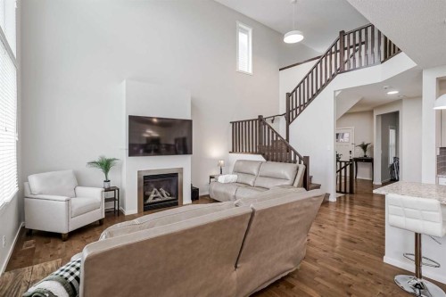225 Kingsmere Cove Se, Airdrie, AB - Indoor With Fireplace