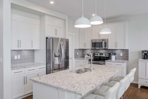 225 Kingsmere Cove Se, Airdrie, AB - Indoor Photo Showing Kitchen With Double Sink With Upgraded Kitchen