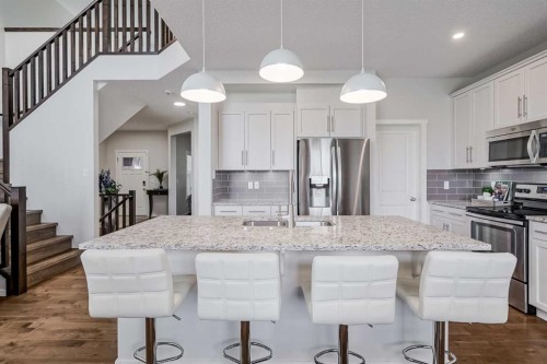 225 Kingsmere Cove Se, Airdrie, AB - Indoor Photo Showing Kitchen With Upgraded Kitchen