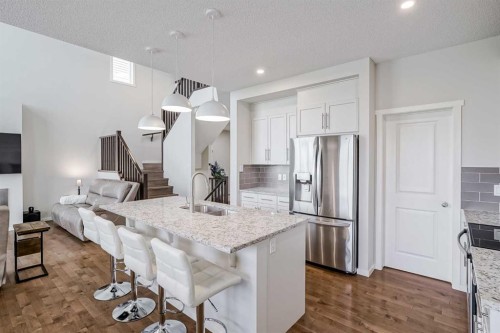 225 Kingsmere Cove Se, Airdrie, AB - Indoor Photo Showing Kitchen With Upgraded Kitchen
