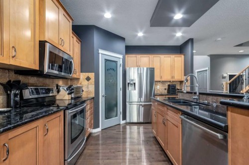 10 Chapala Road Se, Calgary, AB - Indoor Photo Showing Kitchen With Stainless Steel Kitchen With Double Sink With Upgraded Kitchen