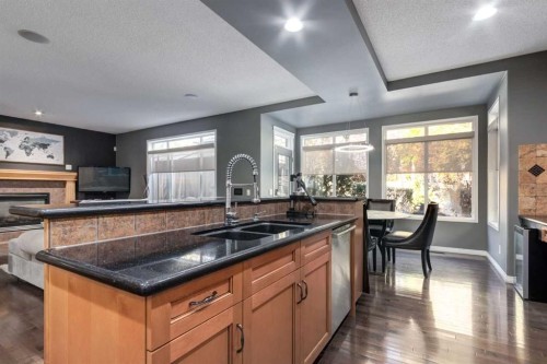 10 Chapala Road Se, Calgary, AB - Indoor Photo Showing Kitchen With Double Sink