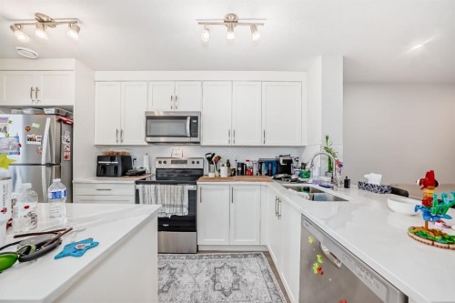 406-474 Seton Circle Se, Calgary, AB - Indoor Photo Showing Kitchen With Double Sink