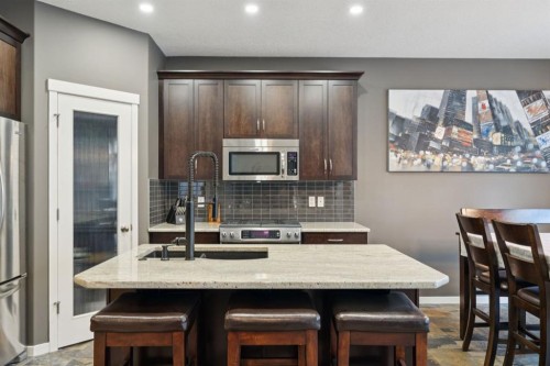 453 River Heights Drive, Cochrane, AB - Indoor Photo Showing Kitchen With Upgraded Kitchen