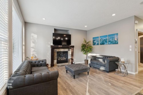 453 River Heights Drive, Cochrane, AB - Indoor Photo Showing Living Room With Fireplace
