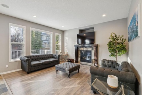 453 River Heights Drive, Cochrane, AB - Indoor Photo Showing Living Room With Fireplace