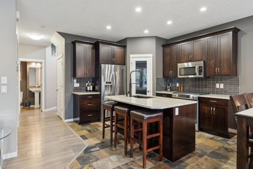 453 River Heights Drive, Cochrane, AB - Indoor Photo Showing Kitchen With Upgraded Kitchen