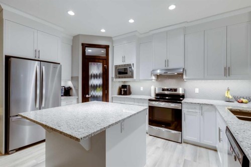 101 Boulder Creek Place, Langdon, AB - Indoor Photo Showing Kitchen With Stainless Steel Kitchen With Double Sink With Upgraded Kitchen