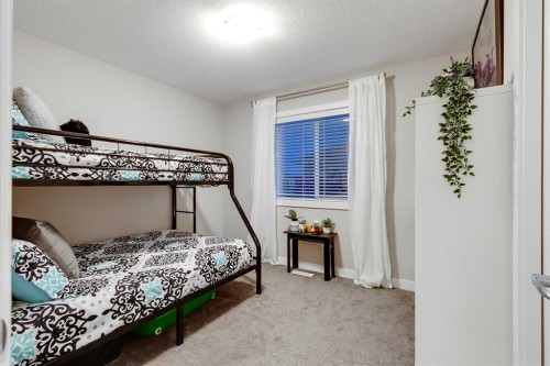 101 Boulder Creek Place, Langdon, AB - Indoor Photo Showing Bedroom