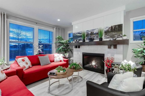 101 Boulder Creek Place, Langdon, AB - Indoor Photo Showing Living Room With Fireplace