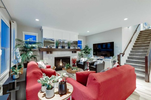 101 Boulder Creek Place, Langdon, AB - Indoor Photo Showing Living Room With Fireplace