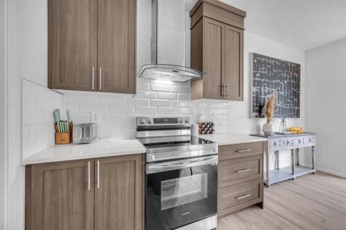 151 Carringham Way Nw, Calgary, AB - Indoor Photo Showing Kitchen With Upgraded Kitchen