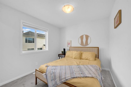 151 Carringham Way Nw, Calgary, AB - Indoor Photo Showing Bedroom