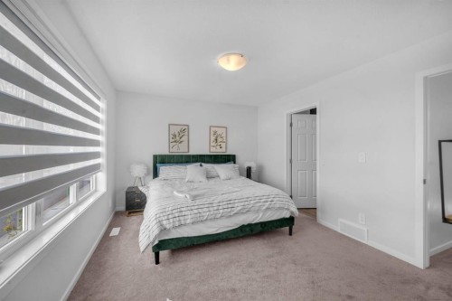 151 Carringham Way Nw, Calgary, AB - Indoor Photo Showing Bedroom