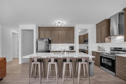 151 Carringham Way Nw, Calgary, AB - Indoor Photo Showing Kitchen With Double Sink