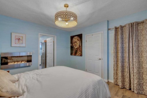 918 11 Avenue Se, Calgary, AB - Indoor Photo Showing Bedroom With Fireplace