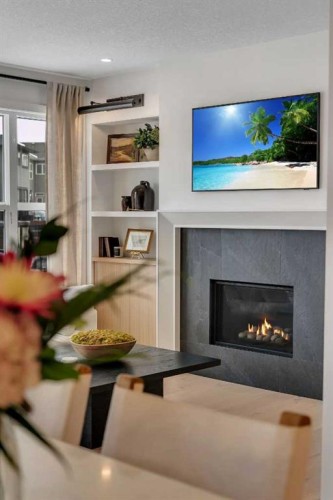 1176 Cranbrook Gardens Se, Calgary, AB - Indoor Photo Showing Living Room With Fireplace