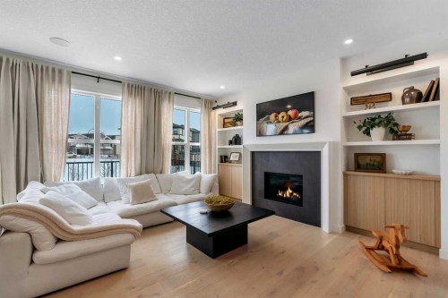 1176 Cranbrook Gardens Se, Calgary, AB - Indoor Photo Showing Living Room With Fireplace