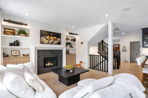1176 Cranbrook Gardens Se, Calgary, AB - Indoor Photo Showing Living Room With Fireplace