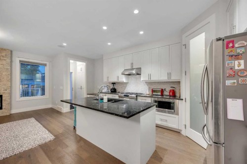 1708 23 Avenue Nw, Calgary, AB - Indoor Photo Showing Kitchen With Stainless Steel Kitchen With Double Sink With Upgraded Kitchen