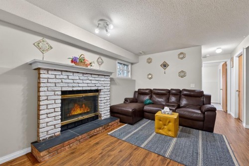 139 Castledale Way Ne, Calgary, AB - Indoor Photo Showing Living Room With Fireplace