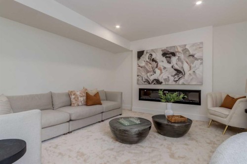 90 Treeline Gardens Sw, Calgary, AB - Indoor Photo Showing Living Room With Fireplace