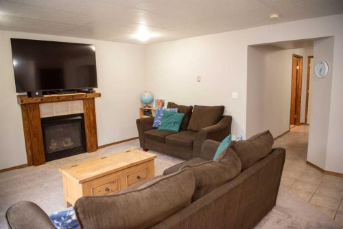 283 Highland Circle, Strathmore, AB - Indoor Photo Showing Living Room With Fireplace