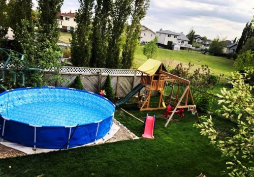 283 Highland Circle, Strathmore, AB - Outdoor With Above Ground Pool