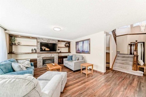 205 Patterson Hill Sw, Calgary, AB - Indoor Photo Showing Living Room With Fireplace