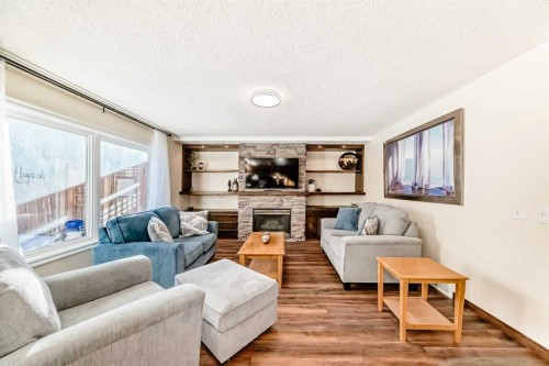 205 Patterson Hill Sw, Calgary, AB - Indoor Photo Showing Living Room With Fireplace