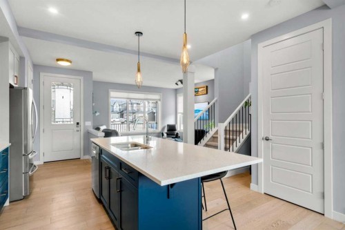 3 Sundown Manor, Cochrane, AB - Indoor Photo Showing Kitchen With Double Sink With Upgraded Kitchen