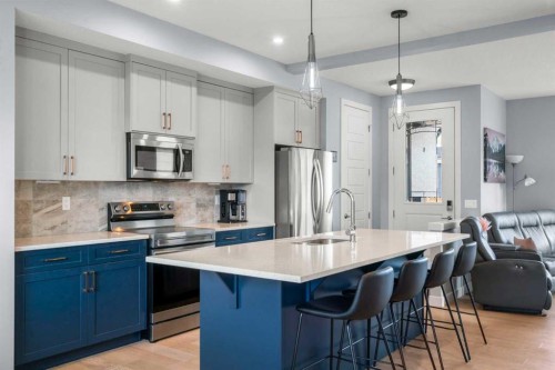 3 Sundown Manor, Cochrane, AB - Indoor Photo Showing Kitchen With Stainless Steel Kitchen With Upgraded Kitchen
