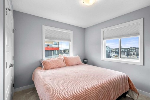3 Sundown Manor, Cochrane, AB - Indoor Photo Showing Bedroom