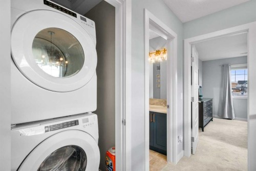 3 Sundown Manor, Cochrane, AB - Indoor Photo Showing Laundry Room