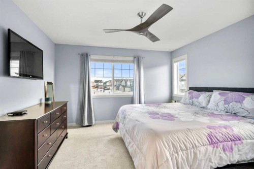 3 Sundown Manor, Cochrane, AB - Indoor Photo Showing Bedroom