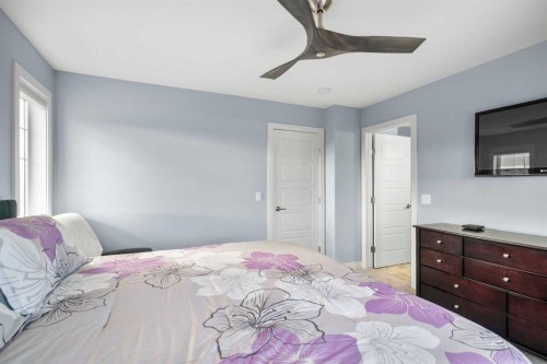 3 Sundown Manor, Cochrane, AB - Indoor Photo Showing Bedroom