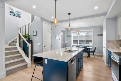 3 Sundown Manor, Cochrane, AB - Indoor Photo Showing Kitchen With Double Sink With Upgraded Kitchen